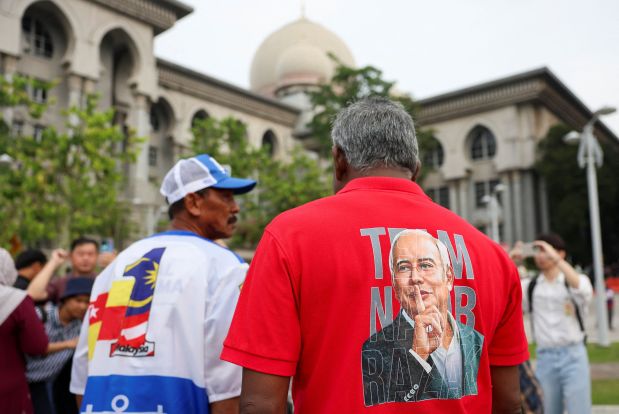 Malaysia’s Najib jailed for 15 more years in 1MDB saga’s biggest trial